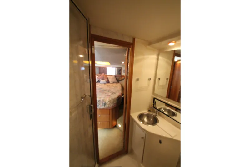 Slide: The Image of Interior of 1996 Bayliner 3988 Command Bridge Motoryacht showing bathroom and bedroom. - 50
