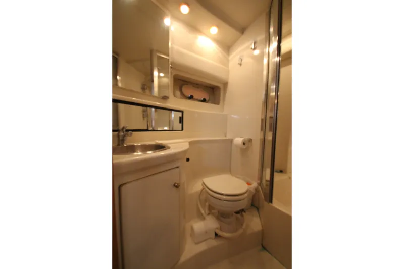 Slide: The Image of Bathroom interior of 1996 Bayliner 3988 Command Bridge Motoryacht, featuring sink and toilet. - 49
