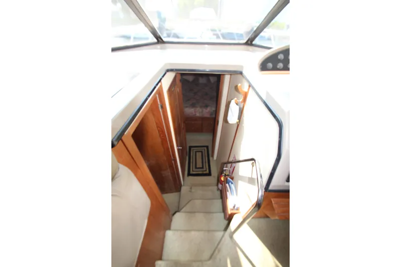Slide: The Image of Interior stairs of 1996 Bayliner 3988 Command Bridge Motoryacht, leading to lower cabin. - 32