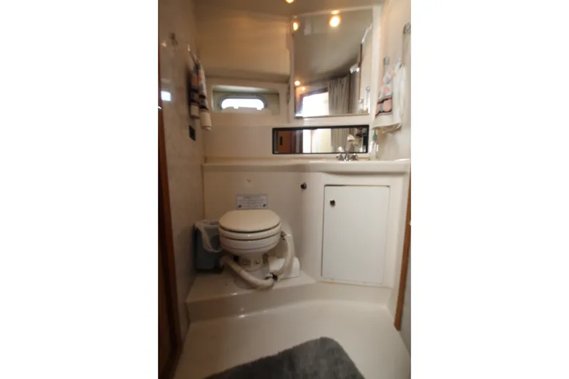 Slide: The Image of Bathroom interior of 1996 Bayliner 3988 Command Bridge Motoryacht with toilet and sink. - 39