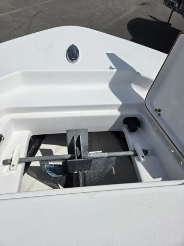Slide: The Image of An anchor is stored in a compartment on a Sportsman Masters 247 Bay Boat. - 11