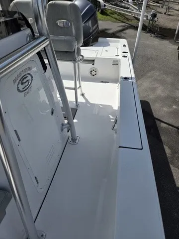 Slide: The Image of The image shows the deck of a 2020 Sportsman Masters 247 Bay Boat with seating area. - 15