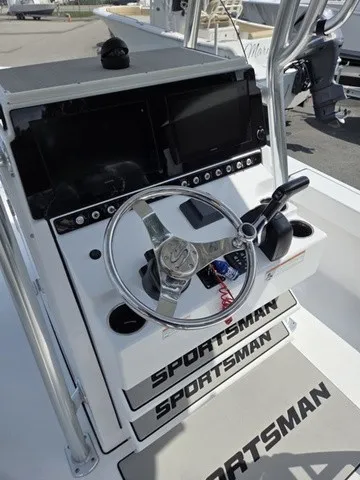 Slide: The Image of The image shows the helm of a 2020 Sportsman Masters 247 Bay Boat with a shiny steering wheel. - 17