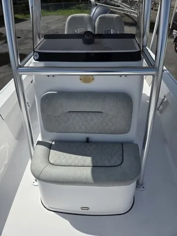 Slide: The Image of The image shows the helm of a 2020 Sportsman Masters 247 Bay Boat with gray upholstery. - 12