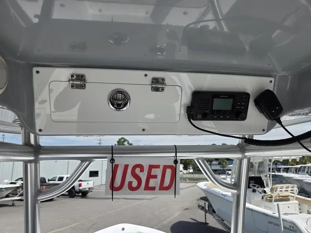 Slide: The Image of The image shows the helm of a 2020 Sportsman Masters 247 Bay Boat with a "Used" sign. - 18