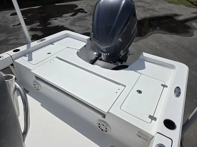 Slide: The Image of The image shows the stern of a 2020 Sportsman Masters 247 Bay Boat with an outboard motor. - 23
