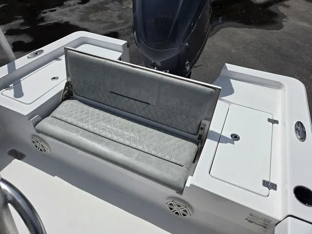 Slide: The Image of The 2020 Sportsman Masters 247 Bay Boat features a cushioned bench seat with storage underneath. - 24