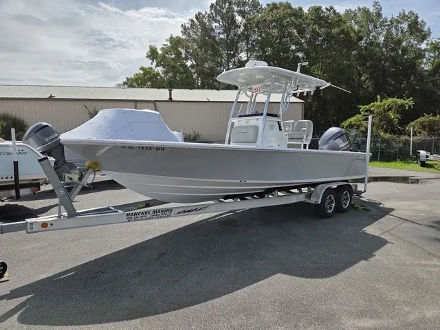 The Image of A gray 2020 Sportsman Masters 247 Bay Boat on a trailer in a yard. - 1