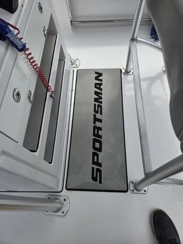 Slide: The Image of The image shows the floor of a Sportsman Heritage 211 Center Console boat with a Sportsman logo. - 18