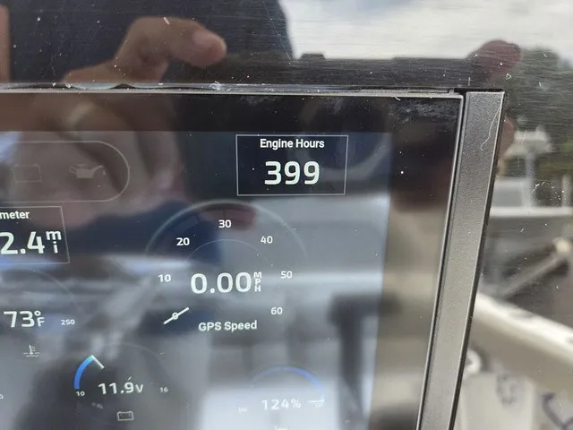 Slide: The Image of A digital display shows 399 engine hours. Additional information includes speed and temperature. - 15