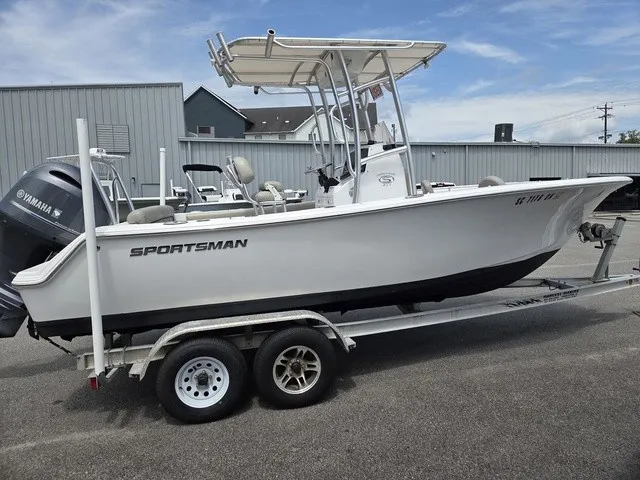 Slide: The Image of A white 2021 Sportsman Heritage 211 Center Console boat is on a trailer. - 3