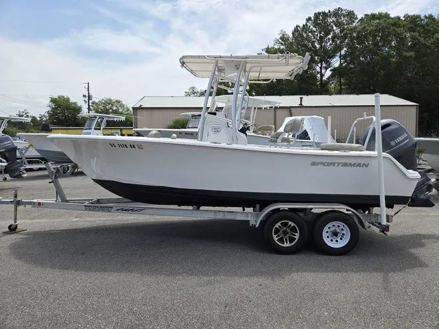 Slide: The Image of A 2021 Sportsman Heritage 211 Center Console boat on a trailer, ready for transport. - 6