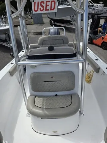 Slide: The Image of The image shows the cockpit of a 2021 Sportsman Heritage 211 Center Console boat. It is marked as used. - 9
