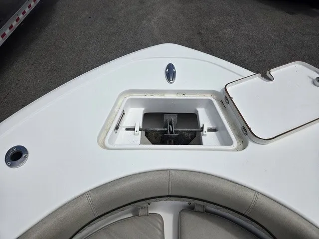 Slide: The Image of The image shows the bow of a Sportsman Heritage 211 Center Console boat with an anchor compartment. - 8