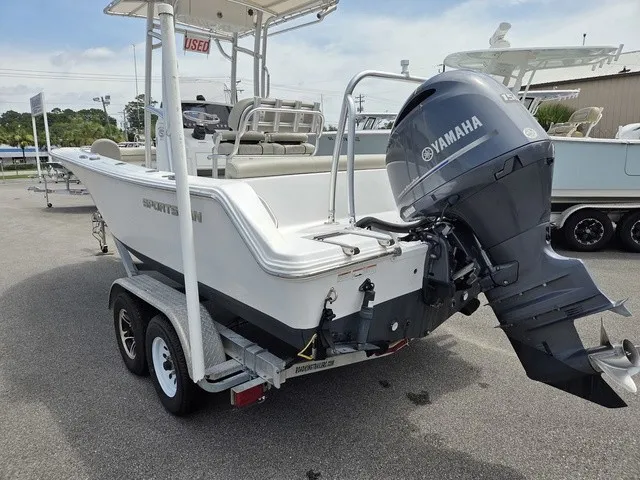 Slide: The Image of A 2021 Sportsman Heritage 211 Center Console boat on a trailer with a Yamaha outboard motor. - 5