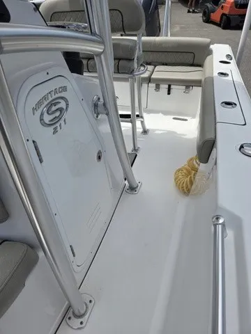 Slide: The Image of The image shows the cockpit of a 2021 Sportsman Heritage 211 Center Console boat. - 12