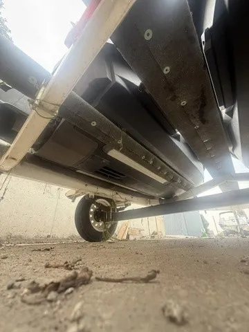 Slide: The Image of Underside view of a Sea-Doo Spark Trixx jet ski on a trailer, focusing on the chassis. - 3