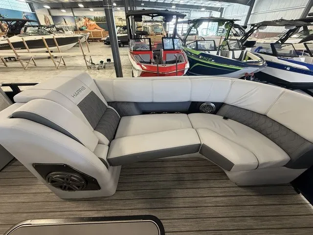 Slide: The Image of The image shows the interior of a 2021 Harris Solstice 250 SLDH with sleek gray upholstery. - 16