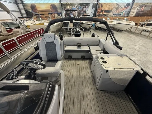 Slide: The Image of The image shows the interior of a 2021 Harris Solstice 250 SLDH with gray seating and a helm. - 18