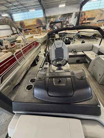 Slide: The Image of The image shows the cockpit of a 2021 Harris Solstice 250 SLDH in a showroom. - 15