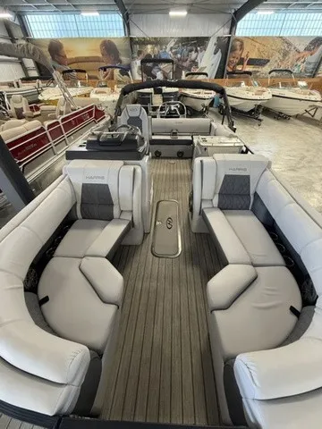 Slide: The Image of The image shows the interior of a 2021 Harris Solstice 250 SLDH with gray seating. - 12