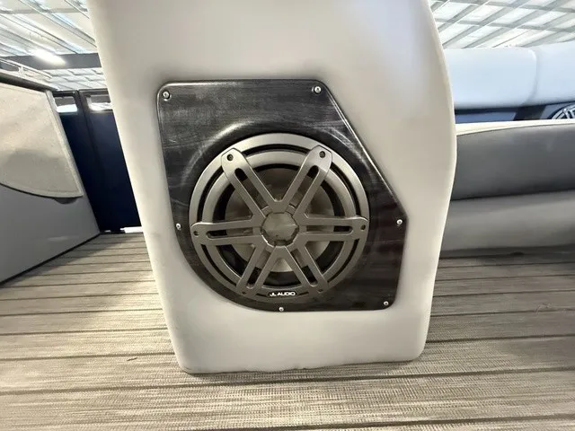 Slide: The Image of A speaker is integrated into the boat's interior paneling, surrounded by gray upholstery. - 17