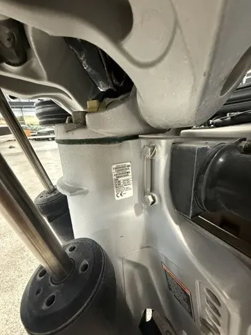 Slide: The Image of Close-up of a boat engine with visible metal components and stickers. - 6