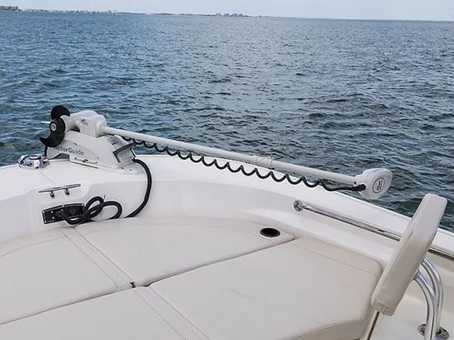Slide: The Image of A Boston Whaler 210 Montauk with a MotorGuide motor on the deck, on calm water. - 8