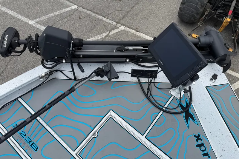 Slide: The Image of 2021 Express X23 BAY boat with Garmin electronics and trolling motor on deck. - 9