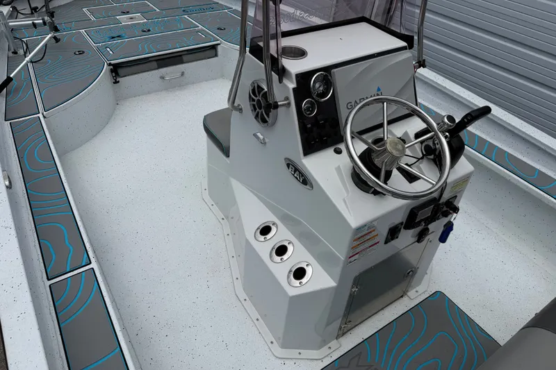 Slide: The Image of 2021 Express X23 BAY boat interior with steering console and modern design. - 11