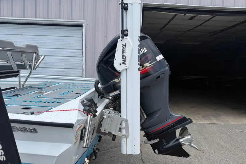 Slide: The Image of 2021 Express X23 BAY boat with Yamaha outboard motor and Talon anchor system. - 23