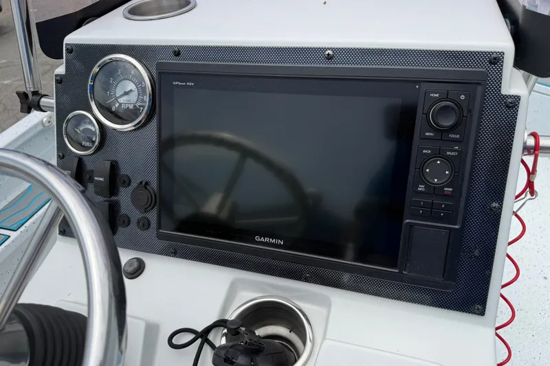 Slide: The Image of Dashboard of 2021 Express X23 BAY boat with Garmin GPS and gauges. - 13