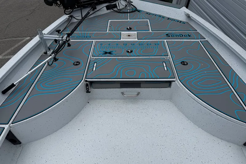 Slide: The Image of 2021 Express X23 BAY boat deck with SeaDek padding and fishing rod holders. - 8