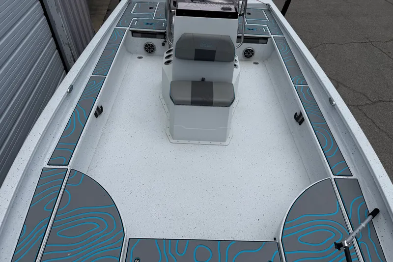 Slide: The Image of 2021 Express X23 BAY boat interior with modern seating and stylish deck design. - 7