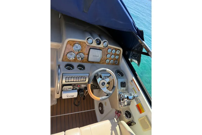 Slide: The Image of 2008 Formula 310 Sun Sport boat dashboard with Garmin navigation and ICOM communication system. - 12
