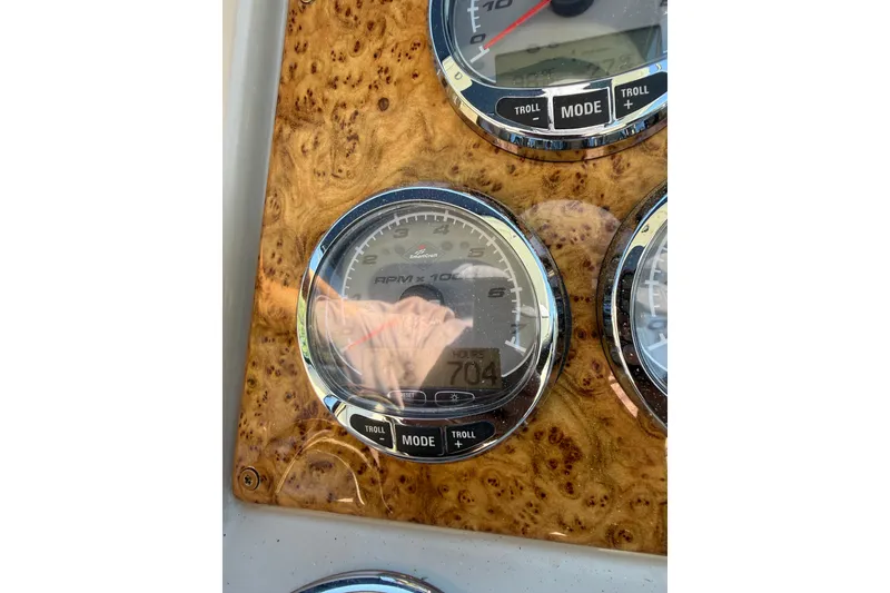 Slide: The Image of Dashboard gauges of a 2008 Formula 310 Sun Sport boat, featuring RPM and mode controls. - 16