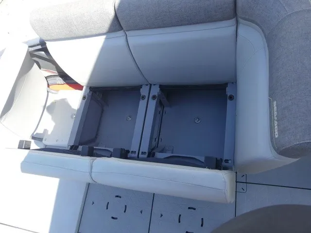 Slide: The Image of The 2023 Sea-Doo Switch Sport 21 features a gray bench seat with storage underneath. - 20