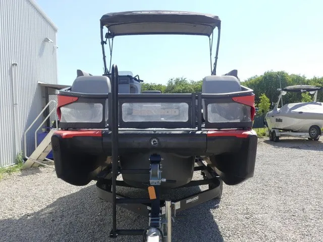 Slide: The Image of A 2023 Sea-Doo Switch Sport 21 on a trailer next to a building. - 7