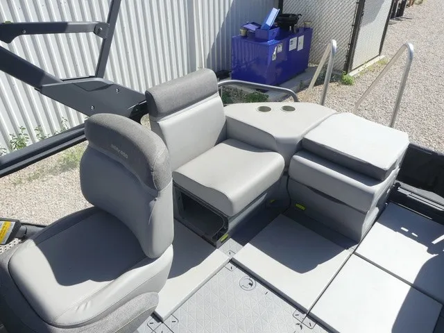 Slide: The Image of The image shows the interior of a 2023 Sea-Doo Switch Sport 21 with gray seating. - 14