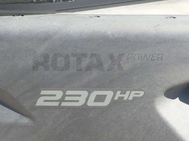 Slide: The Image of Close-up of a boat engine with "Rotax Power 230 HP" written on it. - 24