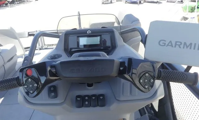Slide: The Image of The image shows the helm of a 2023 Sea-Doo Switch Sport 21 with Garmin navigation. - 17