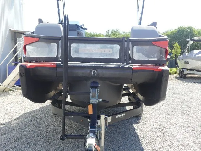 Slide: The Image of The image shows the rear of a 2023 Sea-Doo Switch Sport 21 on a trailer. - 6