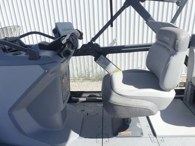 Slide: The Image of The image shows the helm of a 2023 Sea-Doo Switch Sport 21 with a gray seat. - 16