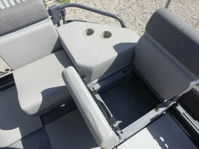 Slide: The Image of Interior view of a 2023 Sea-Doo Switch Sport 21 with gray seats and cup holders. - 21