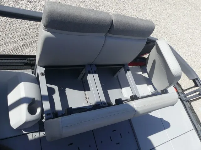 Slide: The Image of The 2023 Sea-Doo Switch Sport 21 features a gray bench seat with adjustable backrests. - 19