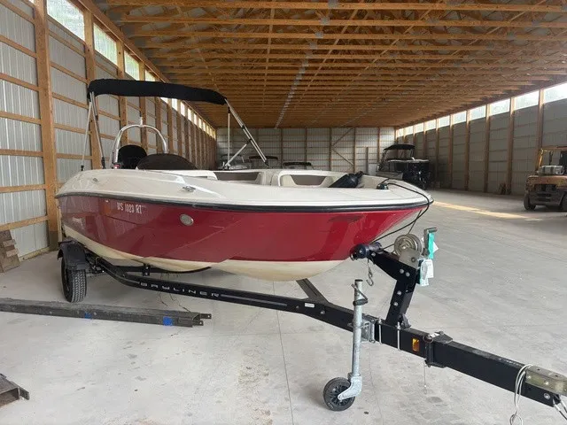 Slide: The Image of A red 2016 Bayliner Element boat is on a trailer in a storage facility. - 4