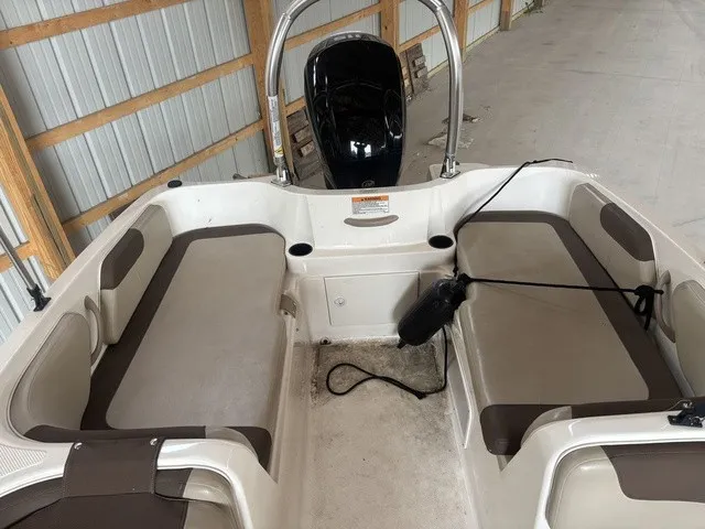 Slide: The Image of The image shows the cockpit of a 2016 Bayliner Element with two cushioned benches. - 12