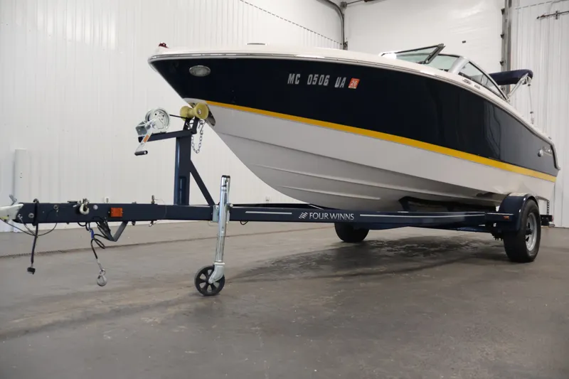 Slide: The Image of 2017 Four Winns H190 boat on trailer in indoor storage facility. - 53