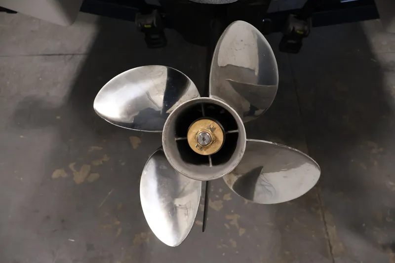 Slide: The Image of Close-up of a 2017 Four Winns H190 boat propeller on a concrete floor. - 51