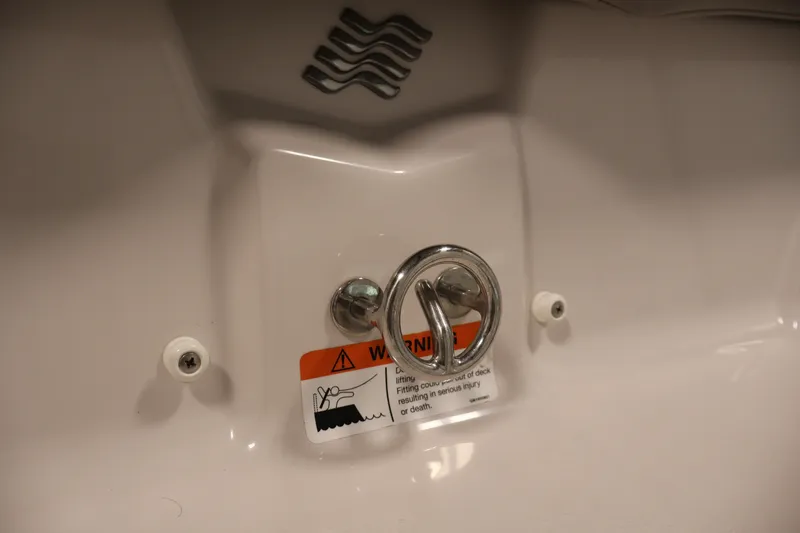 Slide: The Image of 2017 Four Winns H190 boat detail with warning label and metal fixture. - 48